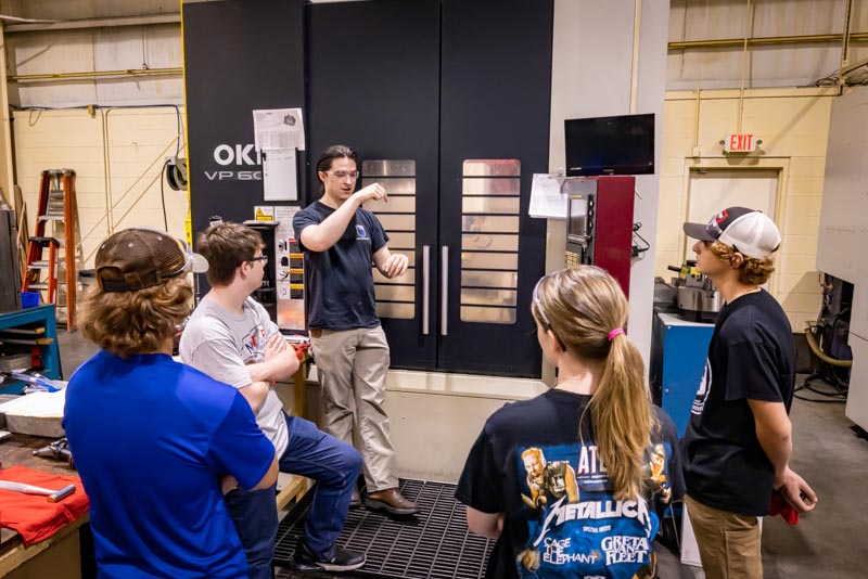 Group training on the 5-axis OKK vertical machining center at Superior Tooling Inc.